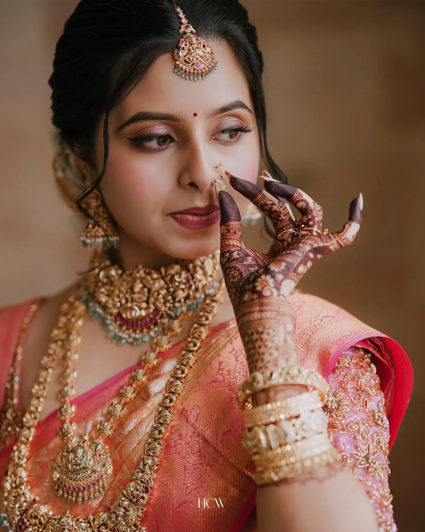 Bride wearing traditional gold wedding jewellery